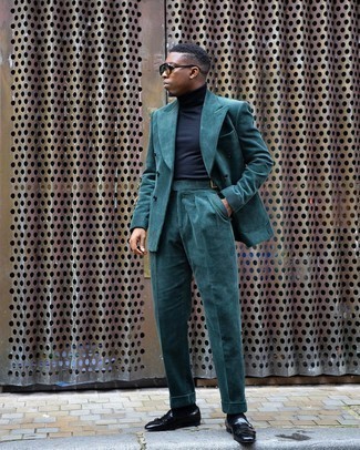 Teal Suit Outfits: A teal suit and a navy turtleneck are a refined combo that every stylish gentleman should have in his sartorial arsenal. When not sure about what to wear in the shoe department, add a pair of black leather double monks to the equation.