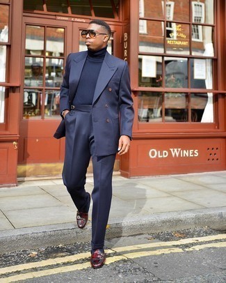 Navy Suit Outfits: This combo of a navy suit and a navy turtleneck spells masculine sophistication. A pair of burgundy leather double monks is a savvy choice to round off your ensemble.