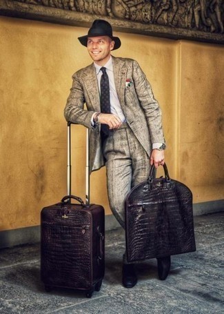 Dark Brown Suitcase Outfits For Men: For an ensemble that offers practicality and fashion, pair a grey suit with a dark brown suitcase. Feeling bold? Spice things up by finishing off with a pair of black leather loafers.