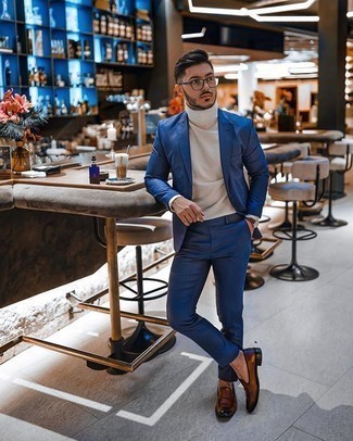 Blue Suit Outfits: Rock a blue suit with a white turtleneck if you're going for a clean-cut, sharp ensemble. When it comes to shoes, this ensemble pairs perfectly with brown leather loafers.