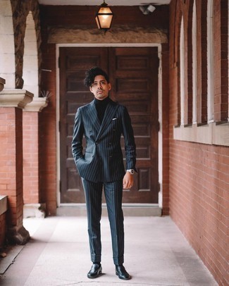 Men's Outfits 2021: For a casually neat ensemble, consider pairing a navy vertical striped suit with a black turtleneck — these two items go really cool together. Amp up the style factor of this outfit with black leather loafers.