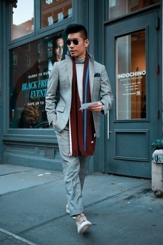 Vertical Striped Scarf Outfits For Men: A grey suit and a vertical striped scarf are a savvy getup to have in your casual styling rotation. A pair of beige canvas low top sneakers integrates seamlessly within a ton of ensembles.