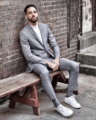 Grey Suit Spring Outfits: Rock a grey suit with a white turtleneck and you'll put together a sleek and classy getup. Finishing with white canvas low top sneakers is a fail-safe way to inject a sense of stylish casualness into your look. As the weather gets warmer, it's time to shed those bulky winter gear and choose an outfit that's lighter, like this one here.