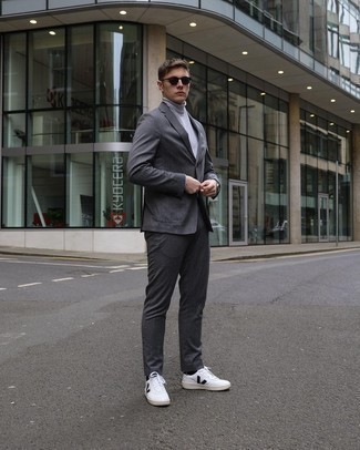Men's Charcoal Suit, Grey Turtleneck, White and Black Leather Low Top Sneakers, Dark Brown Sunglasses