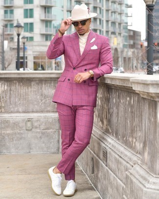 White Pocket Square Outfits: You'll be amazed at how easy it is for any man to get dressed this way. Just a hot pink suit and a white pocket square. White leather low top sneakers are a nice pick to complete this ensemble.