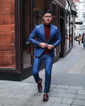 Red Turtleneck Outfits For Men: This refined combo of a red turtleneck and a blue suit is a common choice among the style-conscious chaps. All you need is a pair of burgundy leather monks.