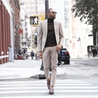 Brown Turtleneck Outfits For Men: To look like a complete gent at all times, make a brown turtleneck and a beige suit your outfit choice. Add a pair of brown leather monks to the equation to tie your full getup together.