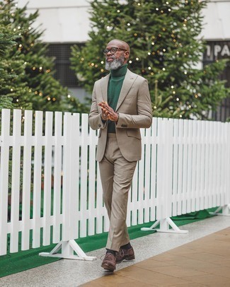 Dark Green Wool Turtleneck Outfits For Men: This pairing of a dark green wool turtleneck and a tan suit is the picture of refinement. To give your overall ensemble a smarter feel, why not introduce dark brown suede oxford shoes to this outfit?