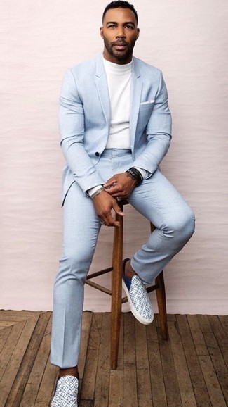 Black Leather Bracelet Outfits For Men: If you're a fan of classic combos, then you'll love this combo of a light blue suit and a black leather bracelet. A pair of white print leather slip-on sneakers is a nice option to complete this look.