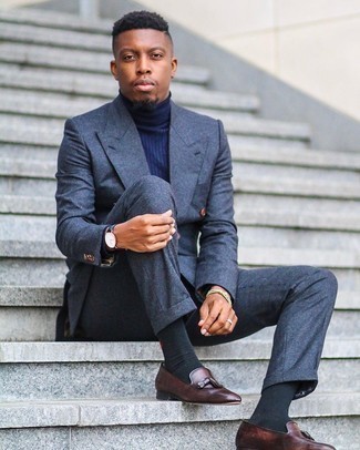Navy Wool Suit Outfits: A navy wool suit looks especially polished when combined with a navy turtleneck in a modern man's look. A pair of dark brown leather tassel loafers integrates nicely within a ton of looks.