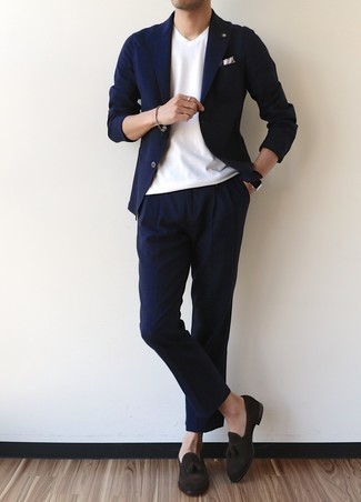 Navy Suit Outfits: A navy suit and a white v-neck t-shirt are an easy way to infuse a dose of manly elegance into your current casual rotation. Dark brown suede tassel loafers will infuse a hint of polish into an otherwise mostly casual outfit.