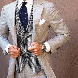 White and Navy Waistcoat Outfits: A white and navy waistcoat looks especially elegant when worn with a grey wool suit in a modern man's look.