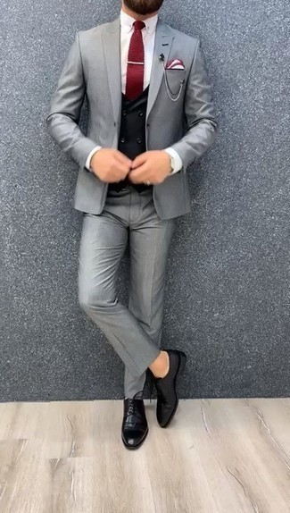 Red Knit Tie Outfits For Men: Marry a grey suit with a red knit tie for truly dapper attire. Go ahead and complement your outfit with black leather derby shoes for a more casual spin.