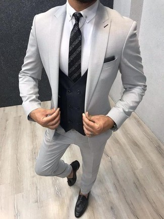 Black Horizontal Striped Tie Outfits For Men: A grey suit looks especially elegant when paired with a black horizontal striped tie in a modern man's combo. Complement this look with black leather tassel loafers to instantly dial up the appeal of this getup.