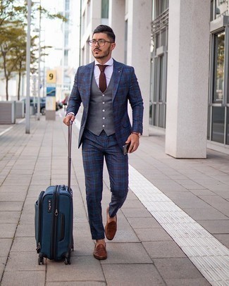 Navy Plaid Suit Outfits: A navy plaid suit and a grey waistcoat are absolute essentials if you're piecing together an elegant wardrobe that matches up to the highest sartorial standards. Complement this look with a pair of brown leather loafers to avoid looking too polished.