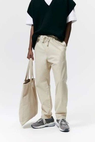 Beige Chinos Warm Weather Outfits: Try pairing a black sweater vest with beige chinos if you're aiming for a proper, stylish outfit. Grey athletic shoes are the simplest way to add a dash of stylish casualness to your outfit.