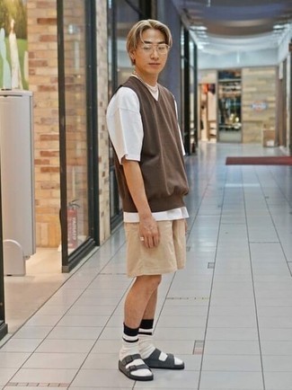 Beige Shorts Outfits For Men: This combination of a brown sweater vest and beige shorts is really eye-catching, but it's super easy to wear. Serve a little mix-and-match magic by sporting a pair of charcoal suede sandals.