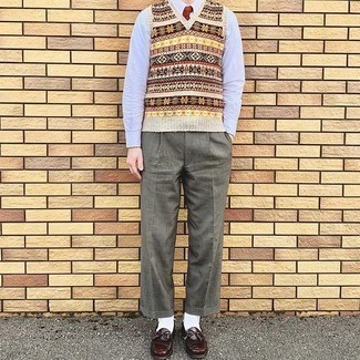 Red Tie Outfits For Men: Look your best in a multi colored fair isle sweater vest and a red tie. Burgundy fringe leather loafers add a little edge to this ensemble.