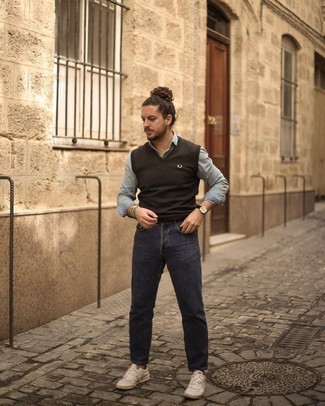 Men's Dark Brown Sweater Vest, Light Blue Chambray Long Sleeve Shirt, Navy Jeans, White Leather Low Top Sneakers