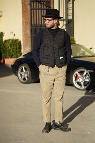 Grey Sweater Vest Outfits For Men: If you take fashion seriously, go for sharp style in a grey sweater vest and khaki chinos. Complete this look with black leather derby shoes for a dash of elegance.