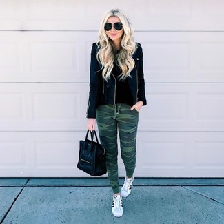 Women's White and Black Leather Low Top Sneakers, Dark Green Camouflage Sweatpants, Black Crew-neck Sweater, Black Leather Biker Jacket