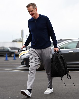 Steve Kerr wearing Grey Check Canvas Slip-on Sneakers, Grey Sweatpants, Navy Crew-neck T-shirt, Navy Hoodie