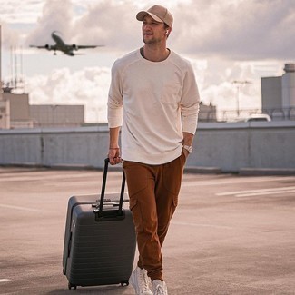 Charcoal Suitcase Outfits For Men: Try teaming a white sweatshirt with a charcoal suitcase to pull together an extra sharp and laid-back outfit. If you wish to easily step up your outfit with a pair of shoes, round off with white canvas high top sneakers.