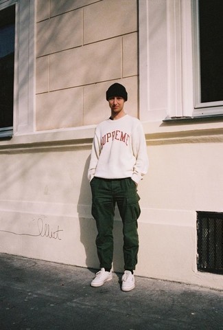 Men's White and Red Print Sweatshirt, Dark Green Cargo Pants, White Leather Low Top Sneakers, Black Beanie