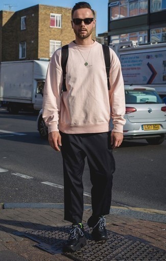 Pink Sweatshirt Outfits For Men: This pairing of a pink sweatshirt and black chinos is on the casual side yet it's also on-trend and really dapper. Complement your look with black athletic shoes to keep the look fresh.
