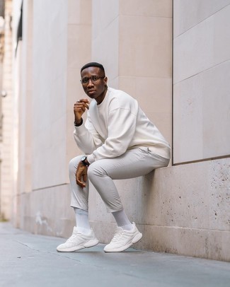 White Sweatshirt Outfits For Men: A white sweatshirt and grey chinos are indispensable menswear essentials if you're figuring out a casual closet that matches up to the highest fashion standards. For times when this outfit appears too classic, dial it down with white athletic shoes.