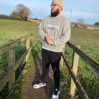 Beige Beanie Outfits For Men: For a casual and cool look, choose a grey print sweatshirt and a beige beanie — these two pieces fit nicely together. Complete this ensemble with a pair of white and black athletic shoes for a masculine aesthetic.