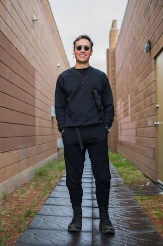 Black Sweatshirt Outfits For Men: A black sweatshirt and black chinos are a nice combo worth having in your day-to-day arsenal. Kick up the classiness of your ensemble a bit by slipping into a pair of dark brown suede casual boots.