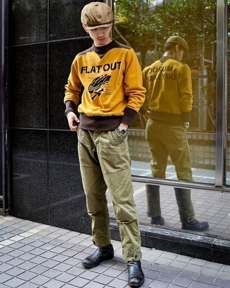 Silver Bracelet Outfits For Men: For a casually dapper ensemble, pair a mustard print sweatshirt with a silver bracelet — these two pieces work really well together. Black leather chelsea boots are an easy way to infuse a sense of sophistication into this getup.