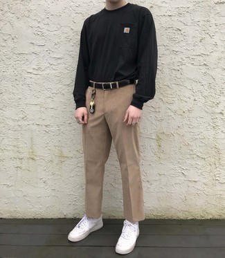 Khaki Corduroy Chinos Outfits: If you appreciate comfort dressing, team a black sweatshirt with khaki corduroy chinos. Introduce a pair of white leather low top sneakers to the equation to pull the whole look together.