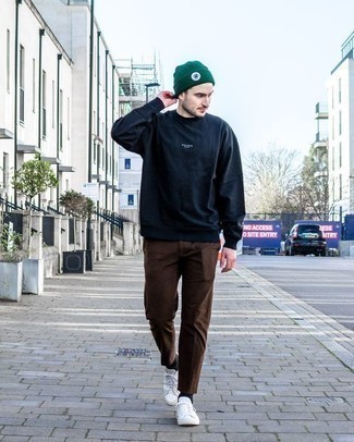 Olive Beanie Outfits For Men: If you gravitate towards relaxed dressing, why not take this combo of a navy sweatshirt and an olive beanie for a spin? Want to dial it up when it comes to footwear? Introduce white canvas low top sneakers to the equation.