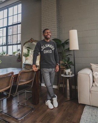 Grey Print Sweatshirt Outfits For Men: If you're on the hunt for a casual but also stylish ensemble, consider wearing a grey print sweatshirt and grey chinos. A pair of white canvas low top sneakers integrates wonderfully within a multitude of combinations.