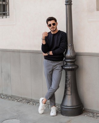 Black Sweatshirt with Low Top Sneakers Casual Outfits For Men: Parade your credentials in men's fashion by putting together a black sweatshirt and grey chinos for an off-duty look. Introduce low top sneakers to the equation and the whole ensemble will come together.