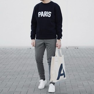 Navy and White Print Sweatshirt Outfits For Men: Rock a navy and white print sweatshirt with grey chinos for a relaxed and fashionable outfit. A pair of white canvas low top sneakers can integrate effortlessly within a ton of getups.