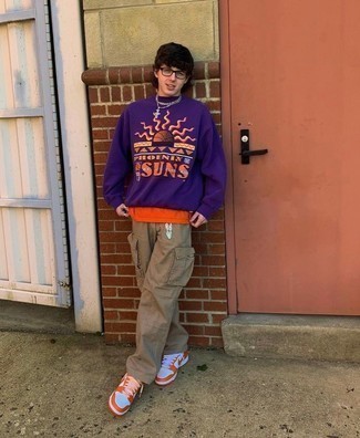 Purple Print Sweatshirt Outfits For Men: This laid-back combo of a purple print sweatshirt and khaki cargo pants is ideal when you need to look cool but have no extra time. If you're clueless about how to round off, enter a pair of orange leather low top sneakers into the equation.