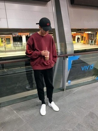 Red Sweatshirt Outfits For Men: A red sweatshirt and black chinos are essential in any guy's versatile off-duty closet. A pair of white leather low top sneakers rounds off this look very well.