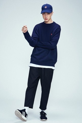 Blue Sweatshirt Outfits For Men: A blue sweatshirt and navy chinos make for the perfect base for a laid-back and cool outfit. Want to break out of the mold? Then why not complete your ensemble with navy and white athletic shoes?