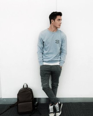 Light Blue Print Sweatshirt Outfits For Men: A light blue print sweatshirt and dark green chinos are a combo that every dapper guy should have in his off-duty styling collection. Have some fun with things and complete this look with black and white canvas high top sneakers.