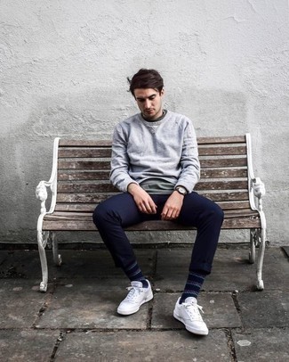 Charcoal Sweatshirt Outfits For Men: Make a charcoal sweatshirt and navy chinos your outfit choice for a simple getup that's also put together. We love how complete this outfit looks when complemented with a pair of white canvas low top sneakers.