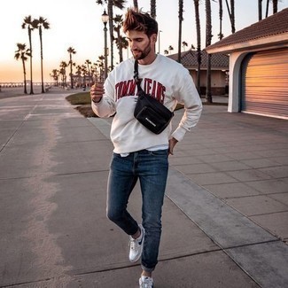 White Sweatshirt Outfits For Men: To put together a casual ensemble with a clear fashion twist, you can easily rock a white sweatshirt and navy jeans. A pair of white and navy canvas low top sneakers serves as the glue that pulls your outfit together.
