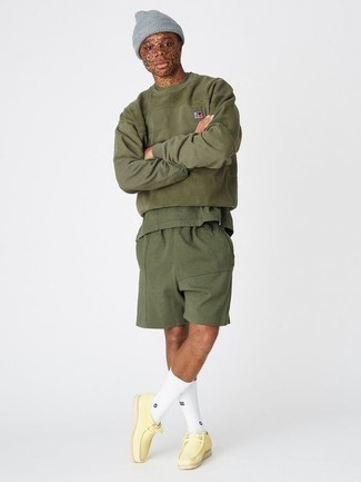 Dark Green Shorts Outfits For Men: Pair an olive sweatshirt with dark green shorts if you want to look cool and casual without too much work. Complete your getup with yellow suede desert boots to completely change up the ensemble.