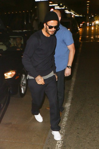 David Beckham wearing Black Sweatshirt, Grey Crew-neck T-shirt, Black Sweatpants, White Leather Low Top Sneakers