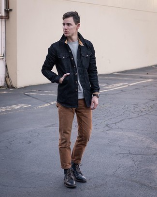 Black Denim Shirt Outfits For Men: This laid-back pairing of a black denim shirt and brown chinos is ideal when you need to look great in a flash. Get a bit experimental when it comes to footwear and introduce black leather casual boots to the equation.