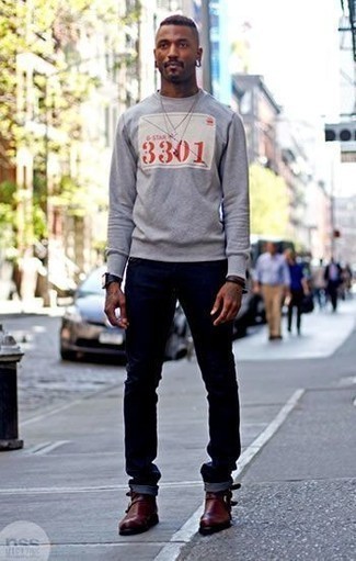 Charcoal Print Sweatshirt Outfits For Men: A charcoal print sweatshirt and navy jeans paired together are the ideal ensemble for those dressers who love casual getups. For extra style points, complement this outfit with a pair of burgundy leather chelsea boots.