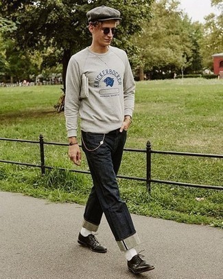 Grey Print Sweatshirt Outfits For Men: A grey print sweatshirt and navy jeans are absolute menswear staples that will integrate brilliantly within your off-duty styling arsenal. For a more refined twist, why not complete your ensemble with a pair of black leather derby shoes?