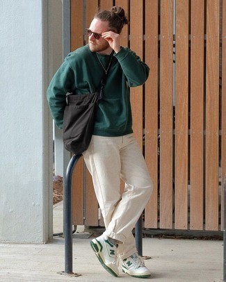 Dark Brown Sunglasses Outfits For Men: A dark green sweatshirt and dark brown sunglasses are amazing menswear elements to integrate into your day-to-day off-duty collection. Feel uninspired with this outfit? Invite a pair of white and green leather low top sneakers to mix things up a bit.